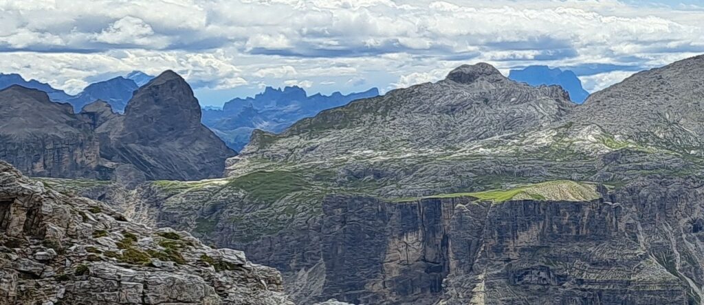 view of a mountain lanscape with some rugged soummits in the back